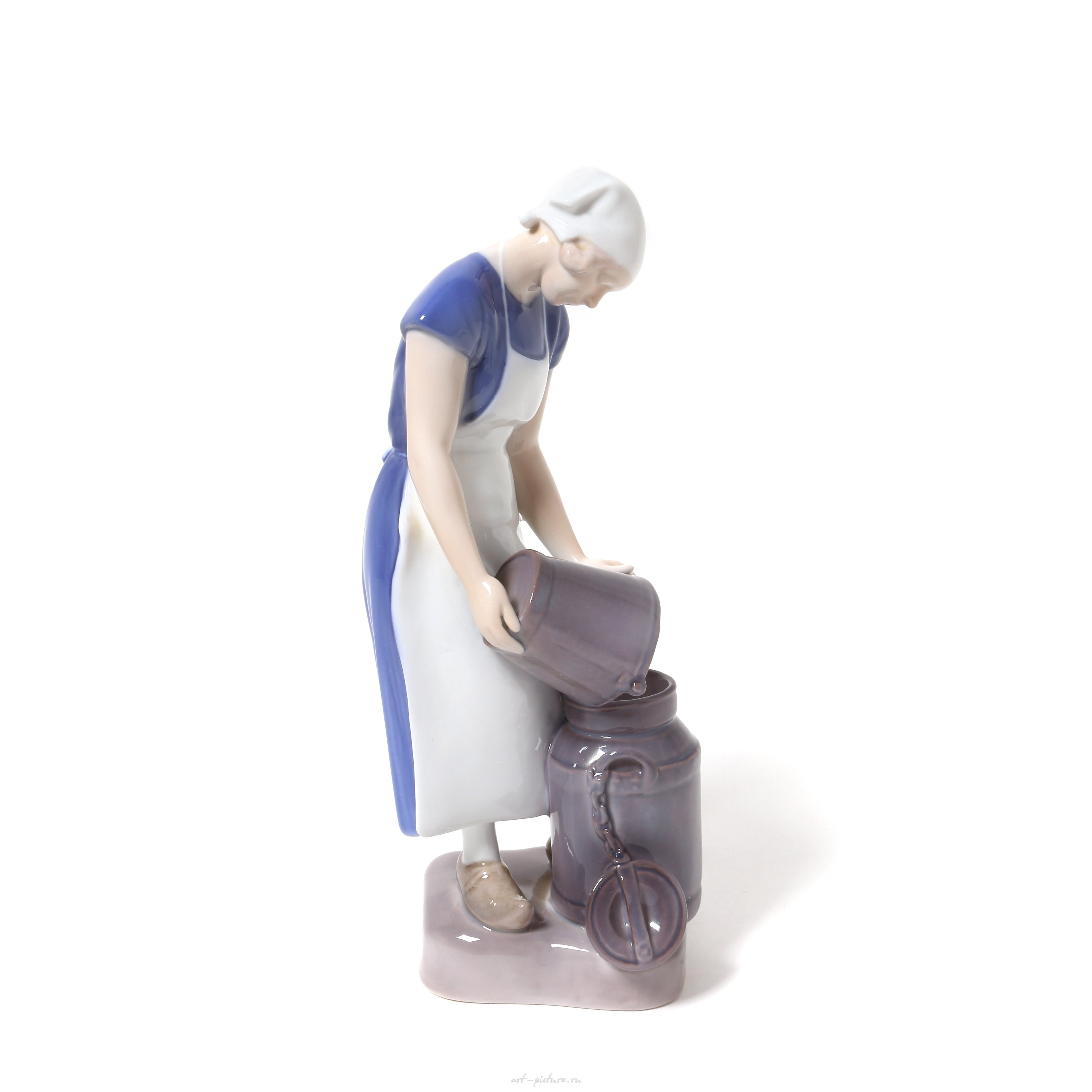 "Girl pouring milk. Denmark, Copenhagen, Bing & Grondahl."