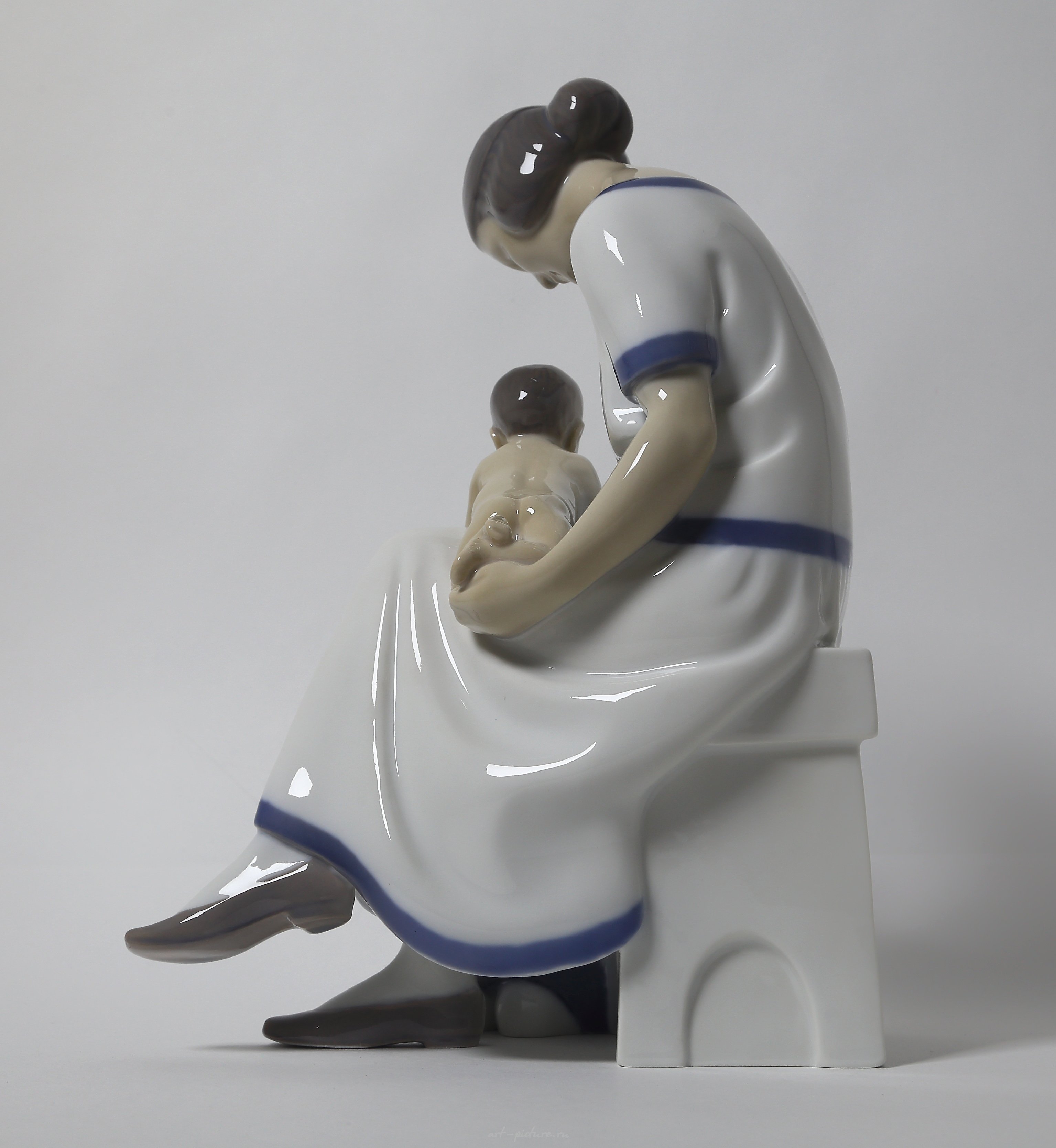 "Mother with two children. Denmark, Copenhagen, Bing & Grondahl."