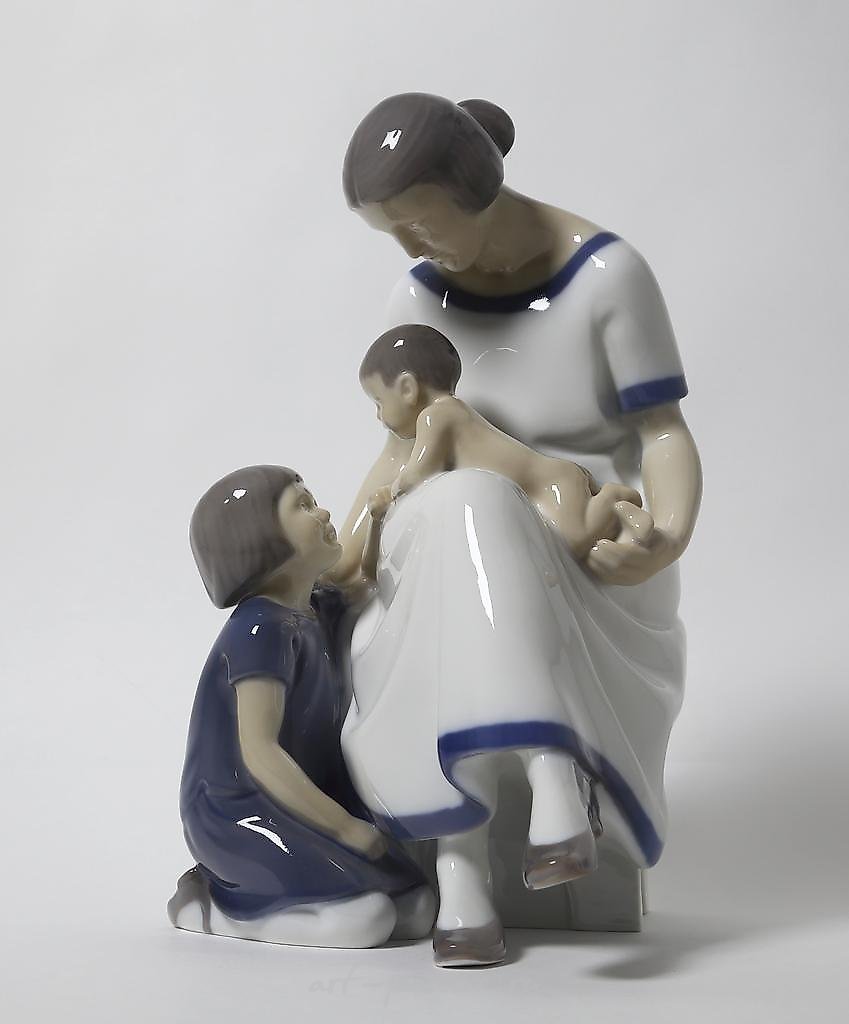 "Mother with two children. Denmark, Copenhagen, Bing & Grondahl."