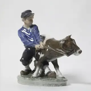 The boy with the calf. Denmark, Copenhagen, Royal Copenhagen.