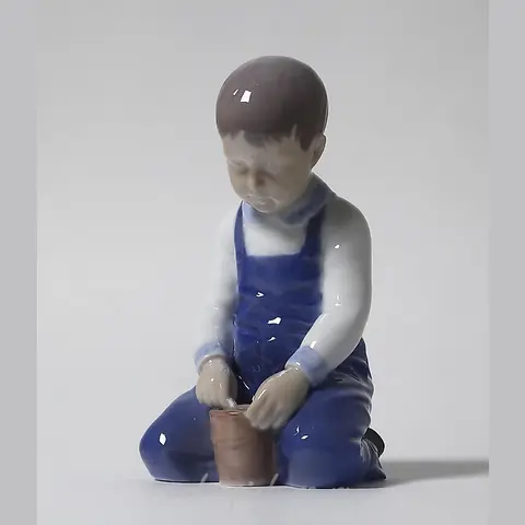 "Boy with a bucket. Denmark, Copenhagen, Bing & Grondahl."