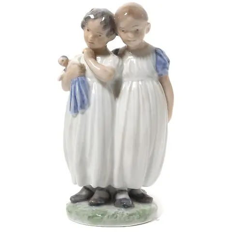 "Girls with a doll. Denmark, Copenhagen, Royal Copenhagen."