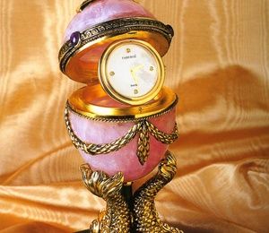 Faberge egg Faberge with a pink quartz clock in the Empire style.
