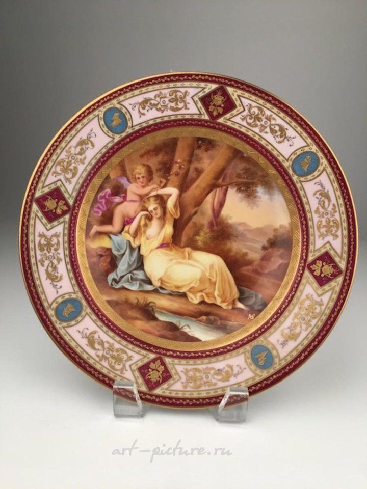 Royal Vienna Porcelain , Royal Vienna portrait plate with a reclining woman and a win...