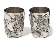Silver shot glasses with dragons, 2 pcs. China, late 19th - early 20th century.