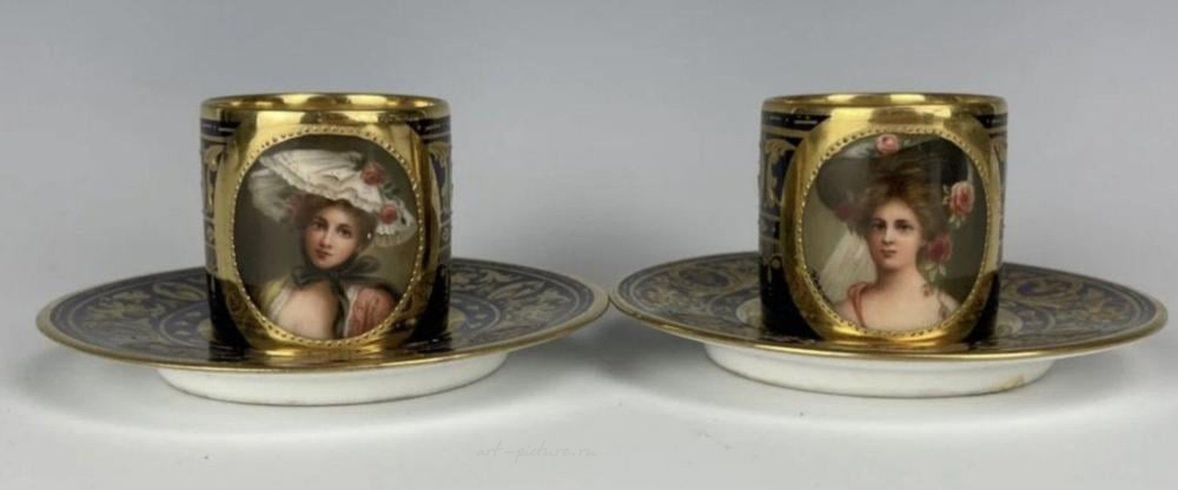 Royal Vienna Porcelain , A PAIR OF ROYAL VIENNA DEMI- TASSE CUPS & SAUCERS