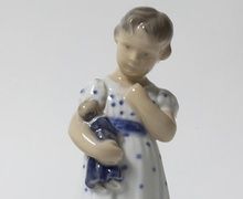 The girl with a doll. Denmark, Copenhagen, Royal Copenhagen.