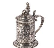 Russian baroque silver-gilt mug with a crowned lid...