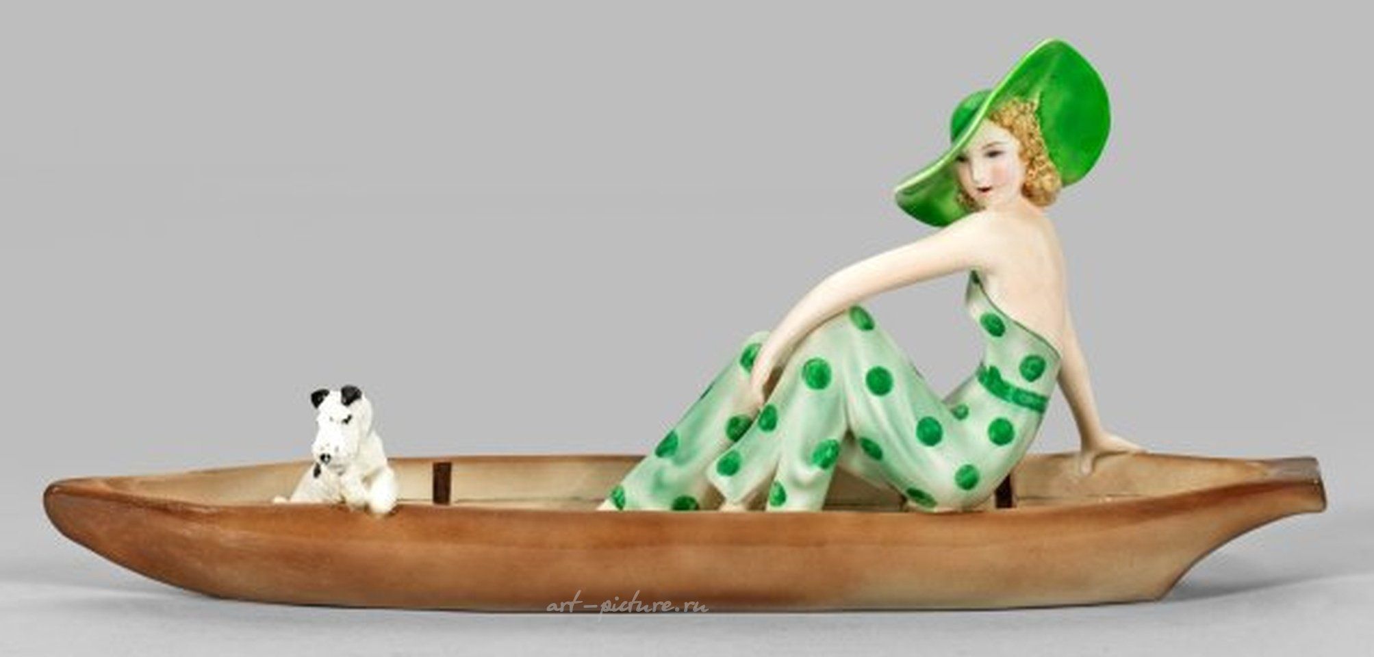 Goldschneider Figure - A sophisticated lady with a fox terrier in a boat.