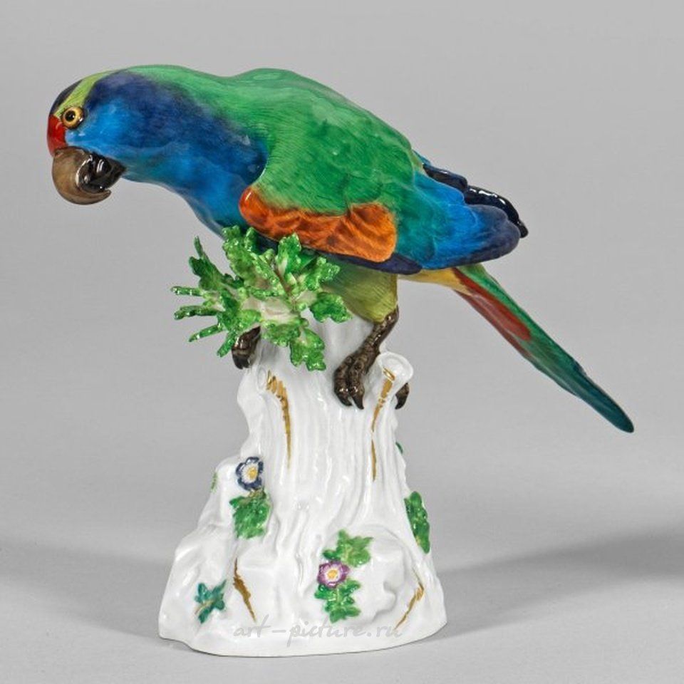 "Papagei" - a colorful parrot figurine on a tree trunk, possibly by Johann Joachim Kändler, Meissen, late 19th century.