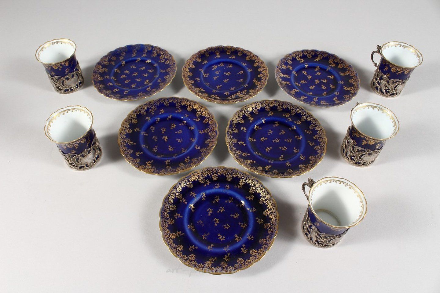 Royal Vienna Porcelain , A SET OF FIVE ROYAL VIENNA BLUE AND GILT CUPS AND SIX SAUCER...