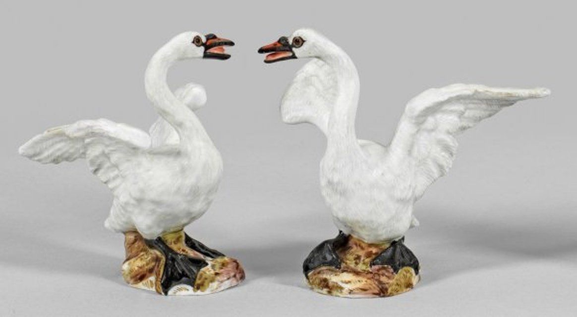 A pair of swan figures as counterparts.