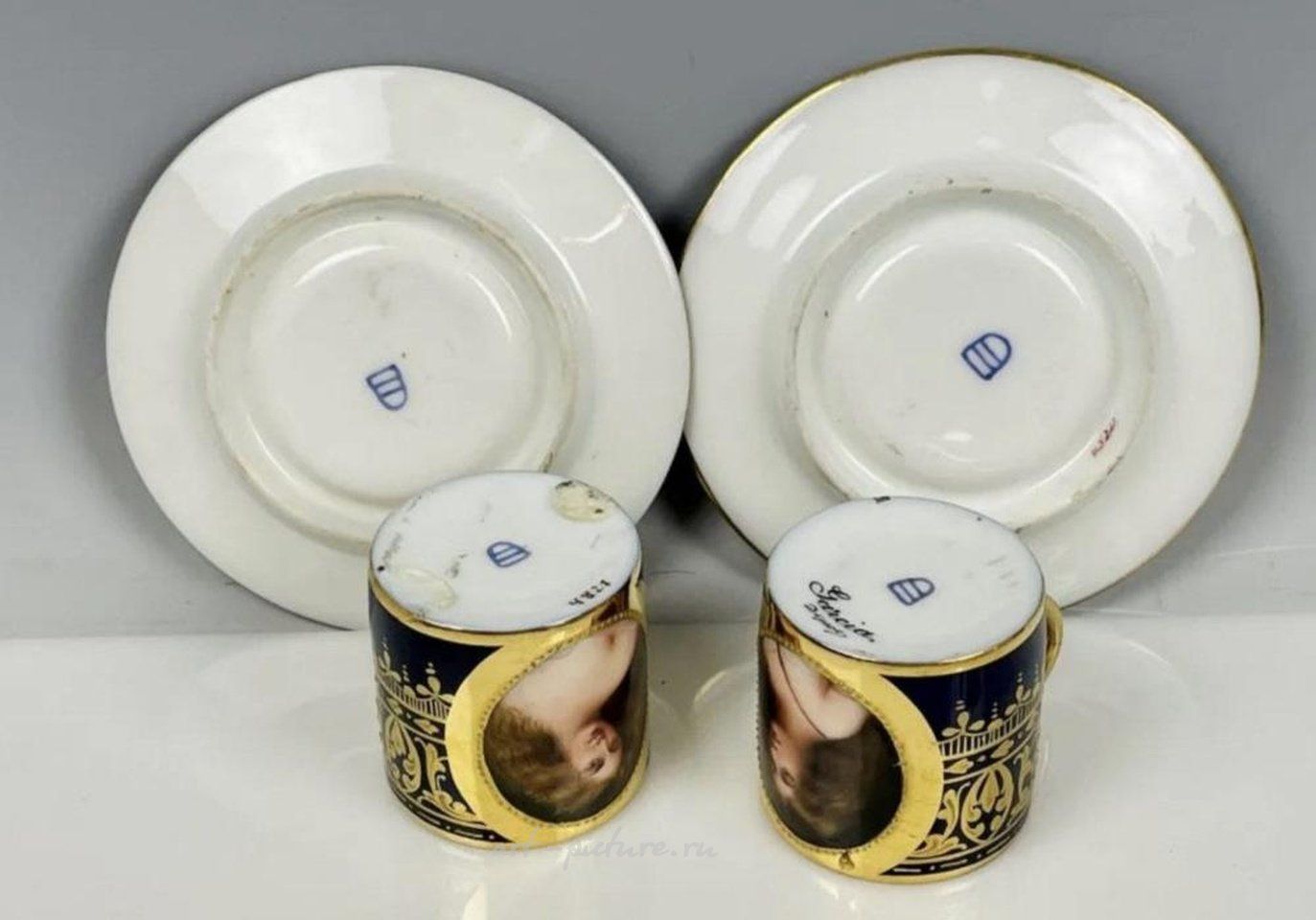 Royal Vienna Porcelain , A PAIR OF ROYAL VIENNA PORTRAIT DEMITASSE CUPS & SAUCER