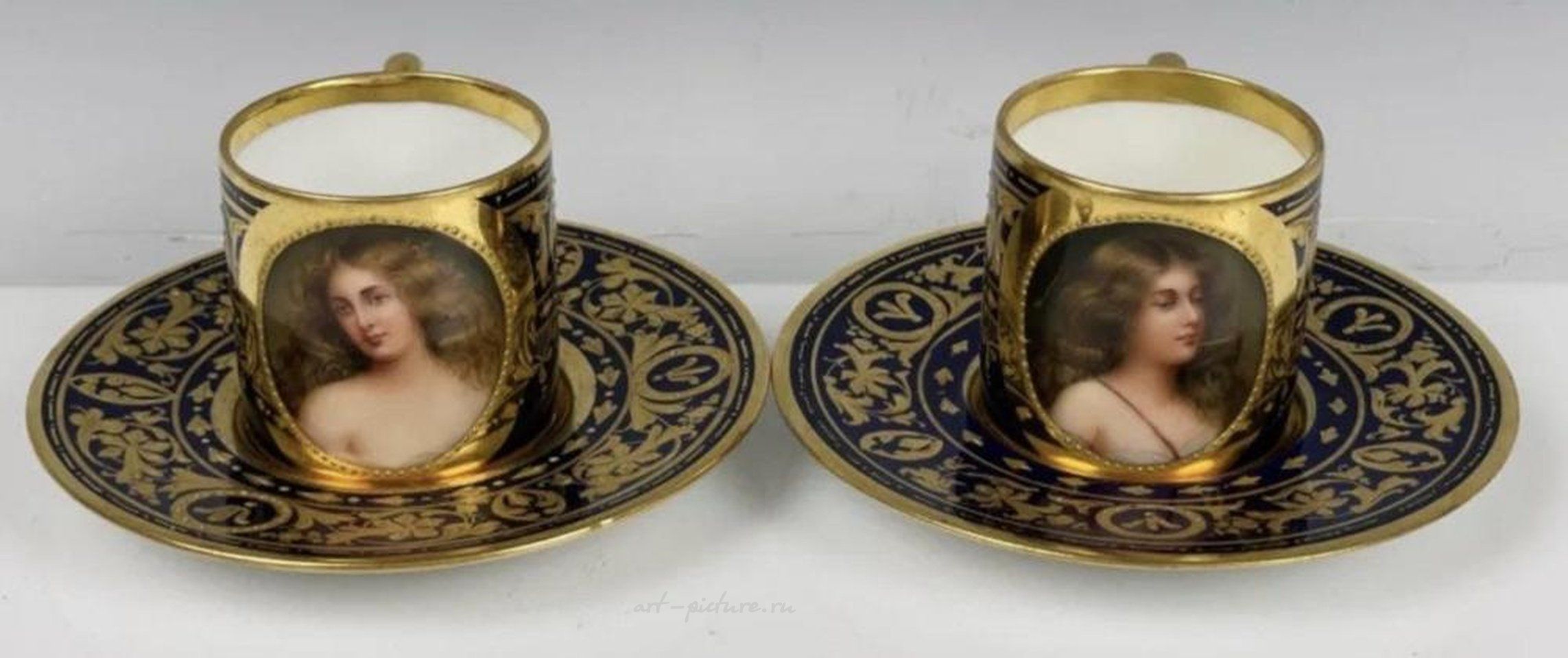 Royal Vienna Porcelain , A PAIR OF ROYAL VIENNA PORTRAIT DEMITASSE CUPS & SAUCER