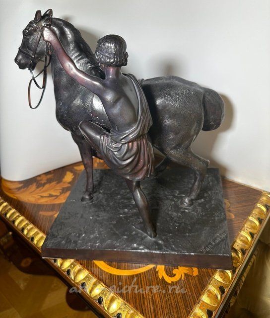 Antique sculpture from the 19th century "The Riding Horseman (Anichkov Bridge)" by the model author Peter Karlovich Klodt, 1846. Bronze.