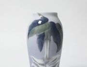Porcelain vase with white flower