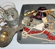 Antique jewelry and two tea glasses with spoons...