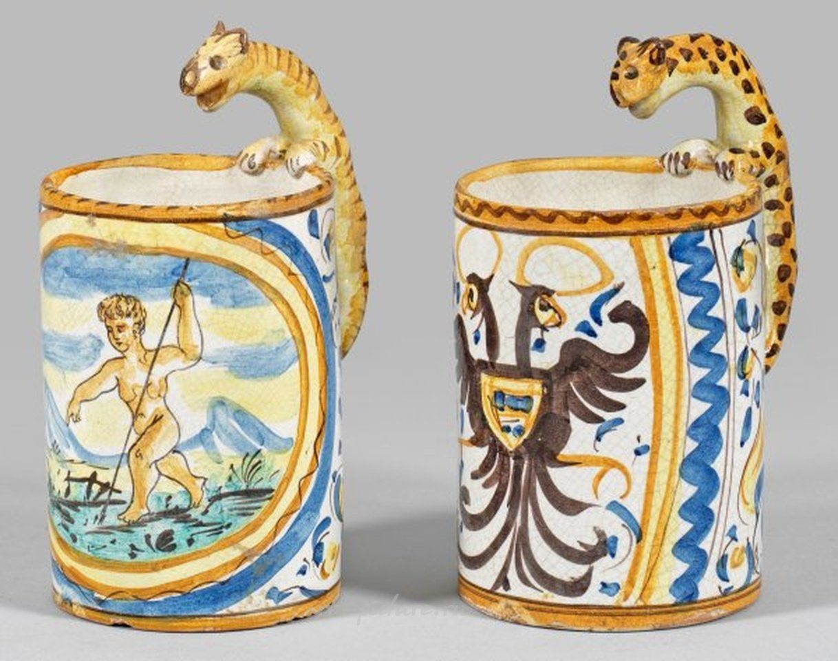 Two cups with leopard handles.