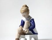 Porcelain figure (figurine) Marianne.Girl ties Bing Grondahl laces