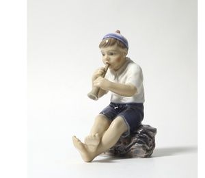 Porcelain figurine "Boy with a pipe".Dahl-Jensen.