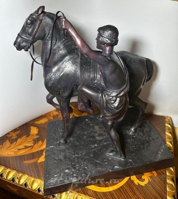 Antique sculpture from the 19th century "The Riding Horseman (Anichkov Bridge)" by the model author Peter Karlovich Klodt, 1846. Bronze.