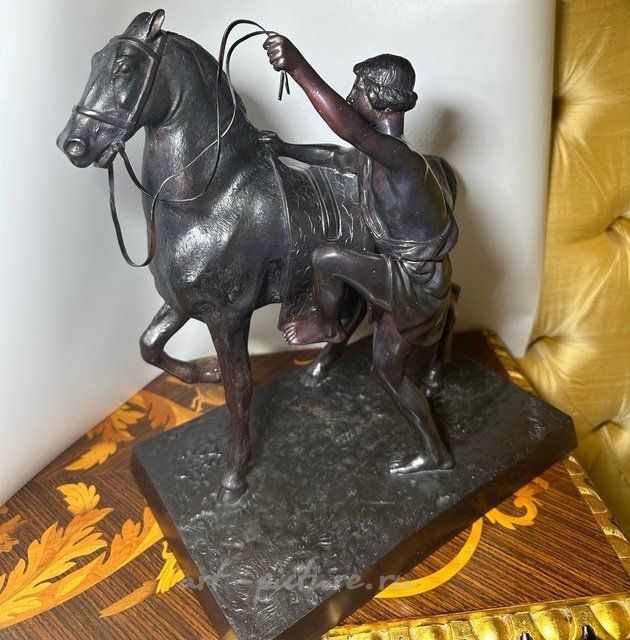 Antique sculpture from the 19th century "The Riding Horseman (Anichkov Bridge)" by the model author Peter Karlovich Klodt, 1846. Bronze.